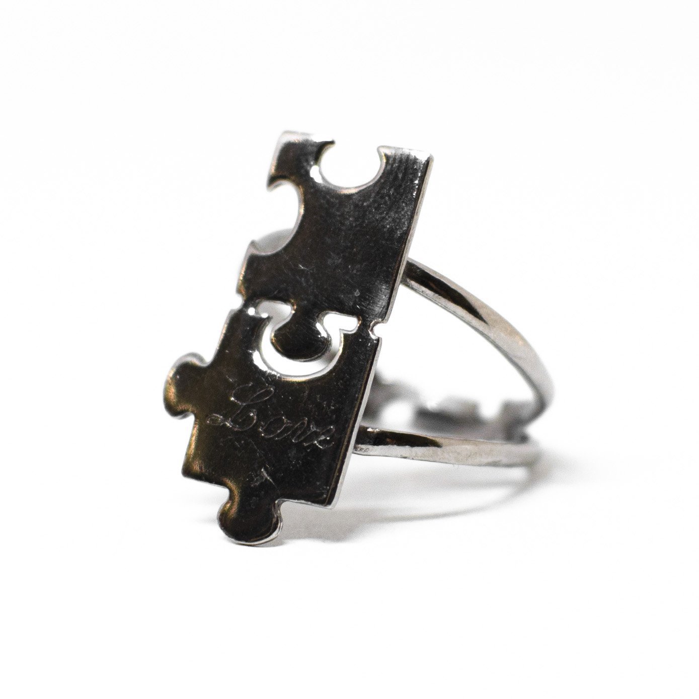 "Lovers' Puzzle" Ring Entirely in Silver